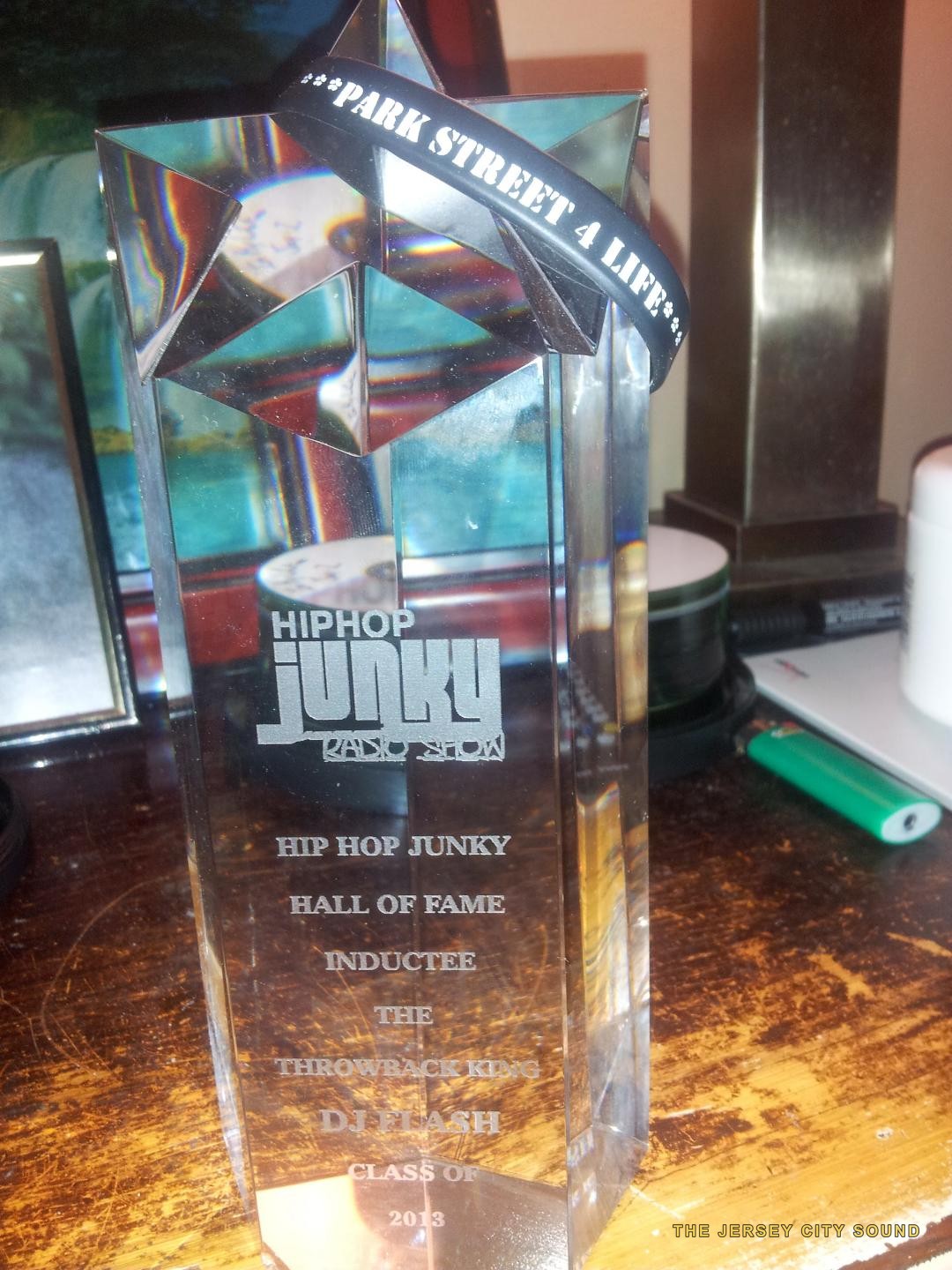 Hip Hop Junky Radio Show Hall of Fame trophy engraved The Throwback King DJ Flash Class of 2013, with a Park Street 4 Life wristband