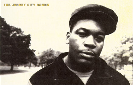 Black and white portrait of a young Double J in a black cap