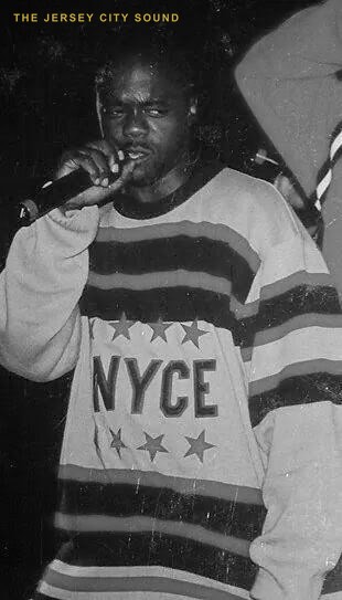 Rigga Mortis performing on the microphone in an NYCE jersey